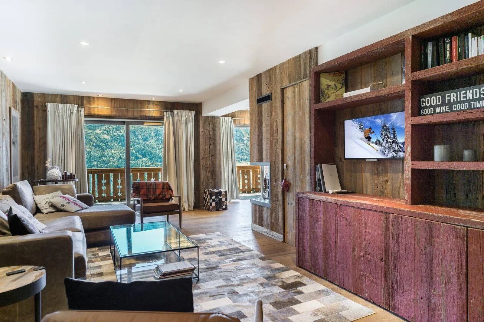 TV lounge with balcony access and timber cabinetry
