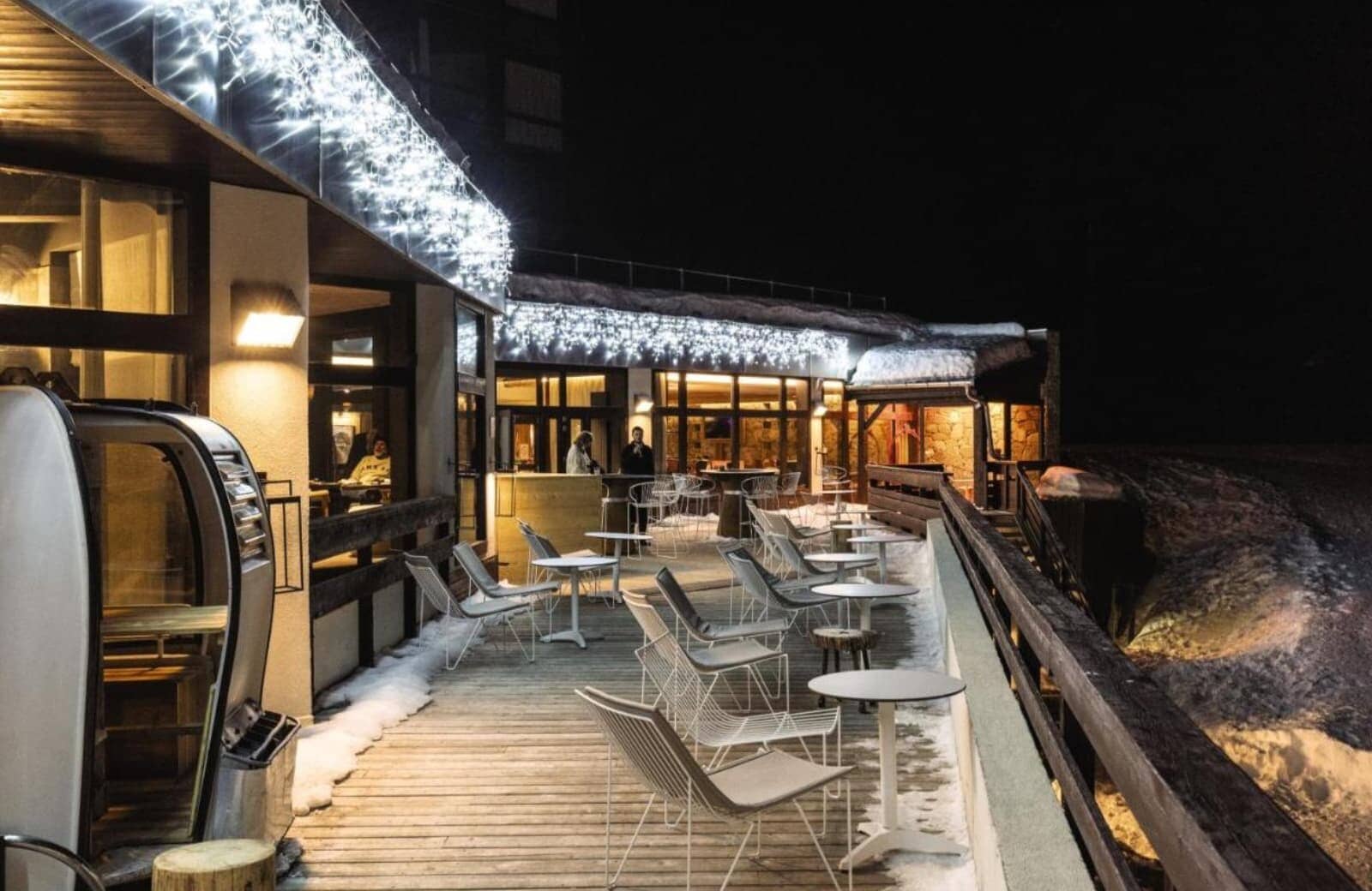 Ski-in/ski-out terrace with heated outdoor seating and gondola cabin booth