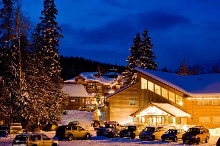 Ski-in lodging exterior with ample on-site guest parking