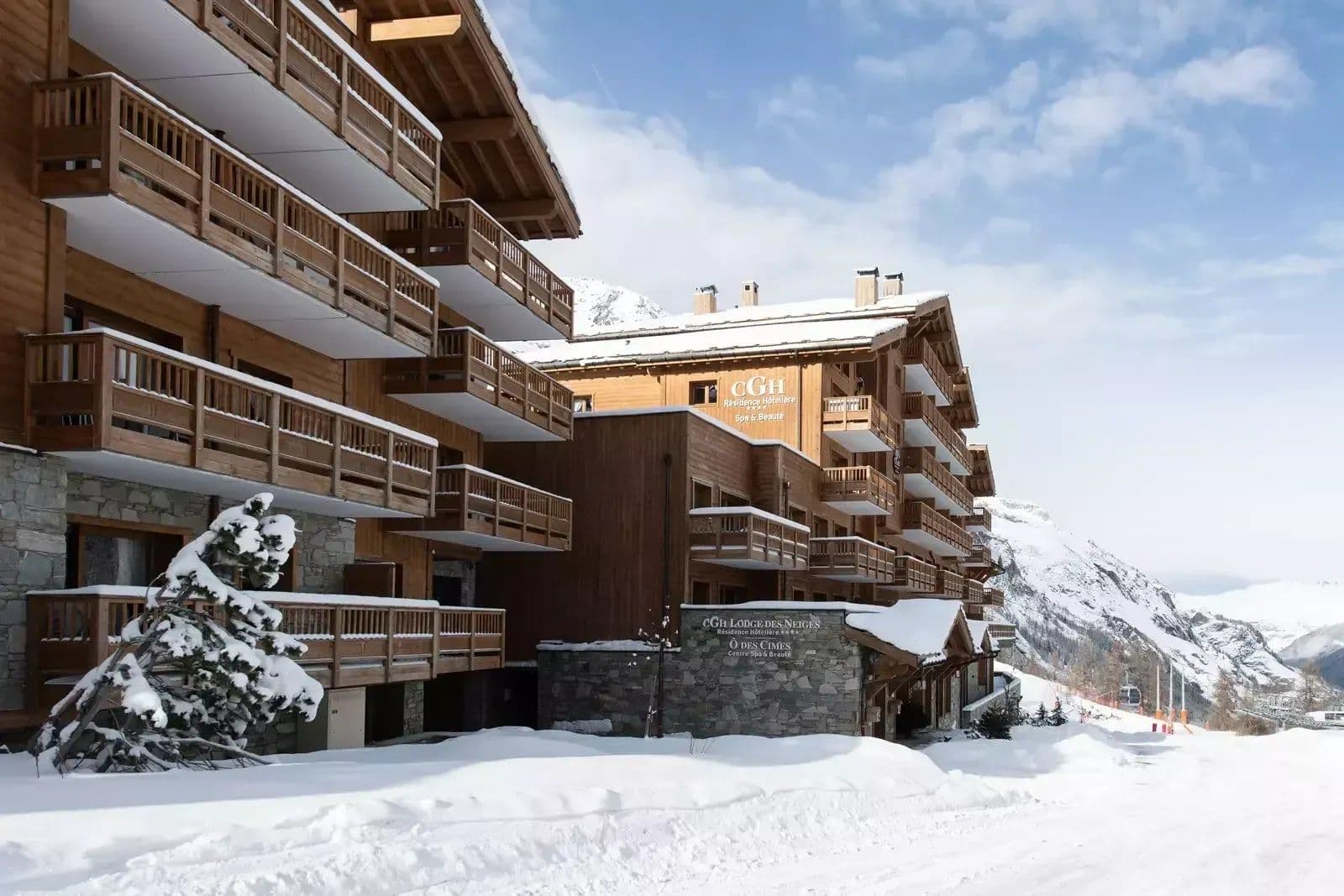 Ski-in/ski-out lodge exterior with private balconies and mountain views