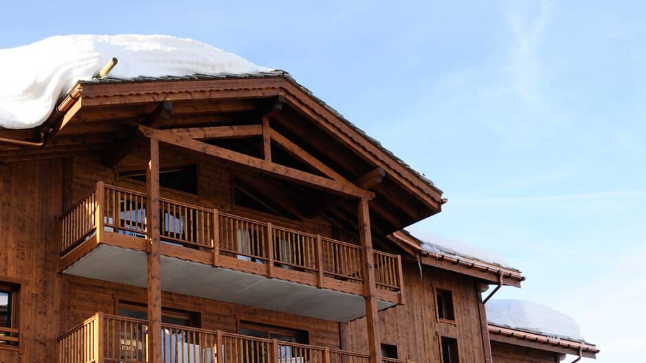 Chalet exterior with timber cladding and private multi-level balconies
