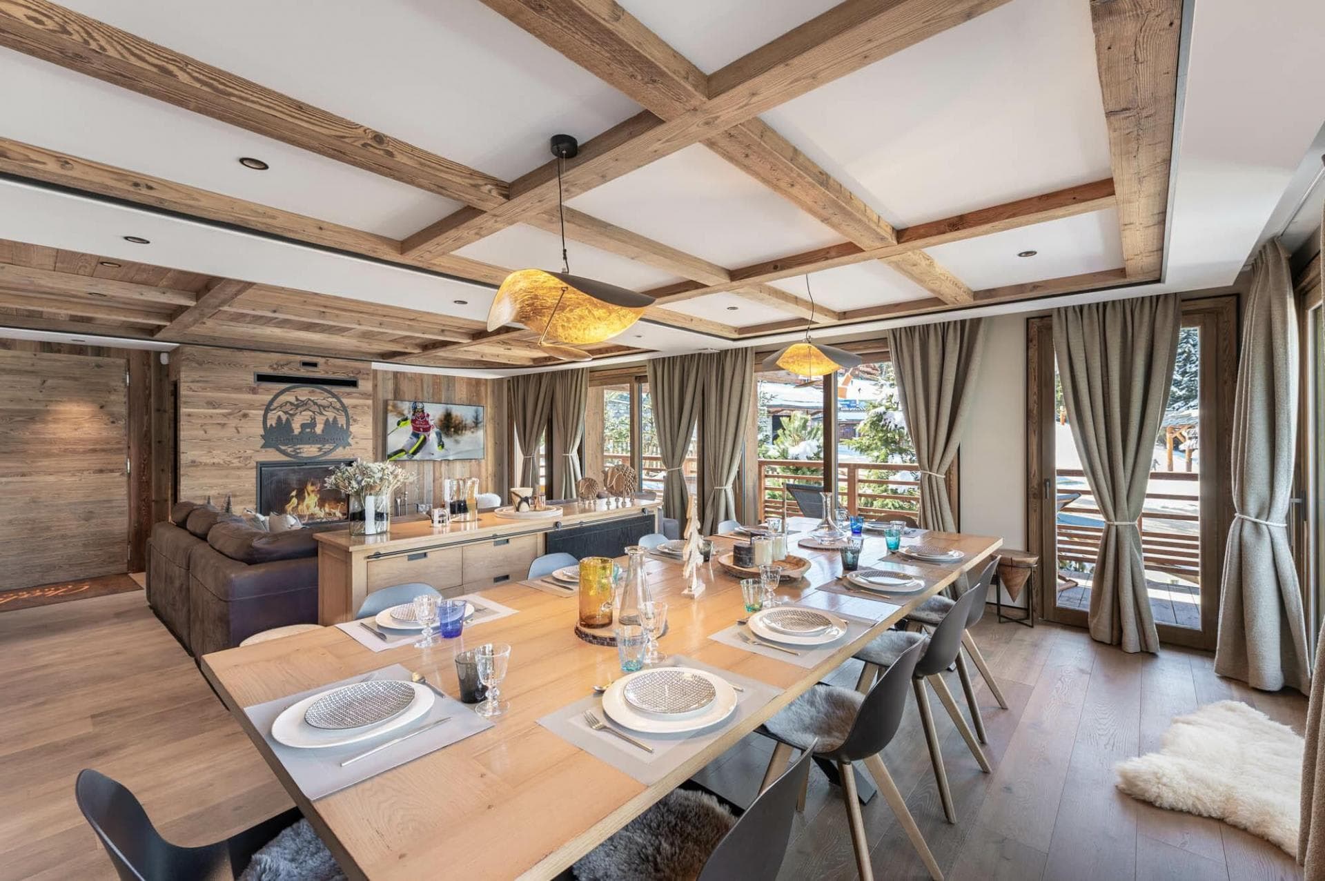 Dining table for ten beside the main lounge and fireplace