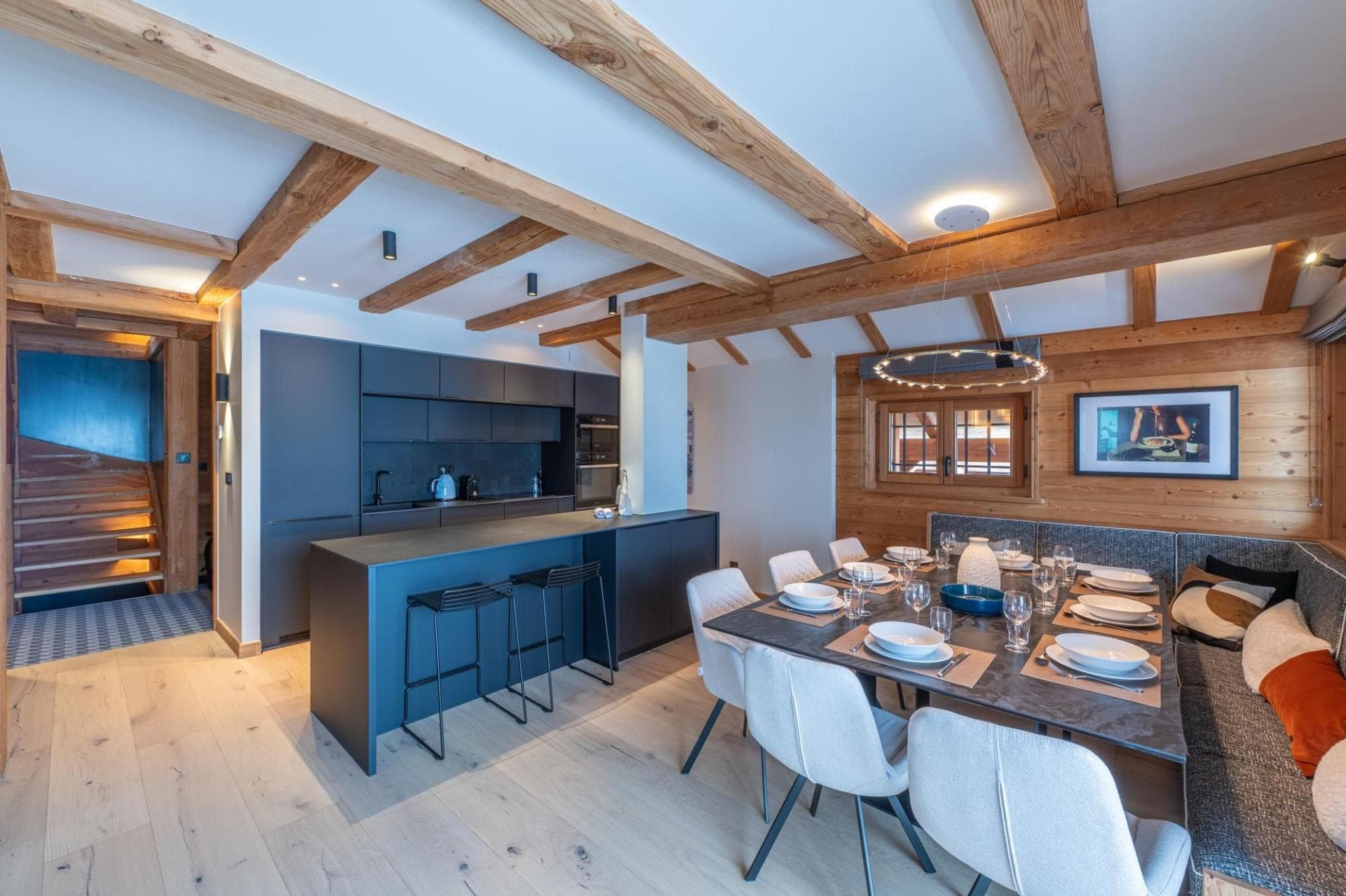 Open-plan dining area with banquette seating and breakfast bar