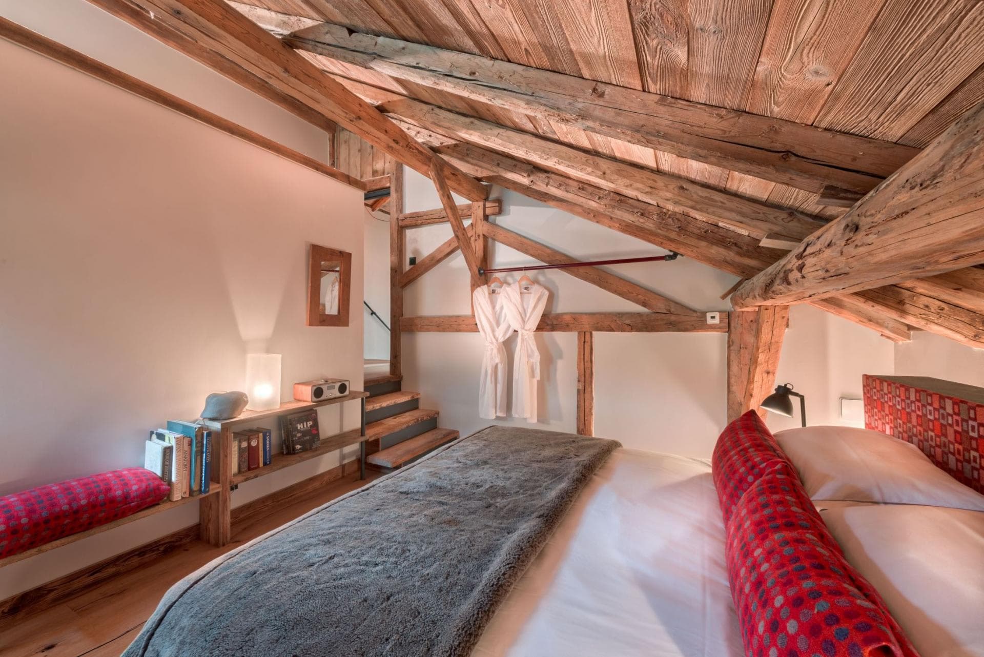 Top-floor double or twin bedroom beneath exposed timber beams