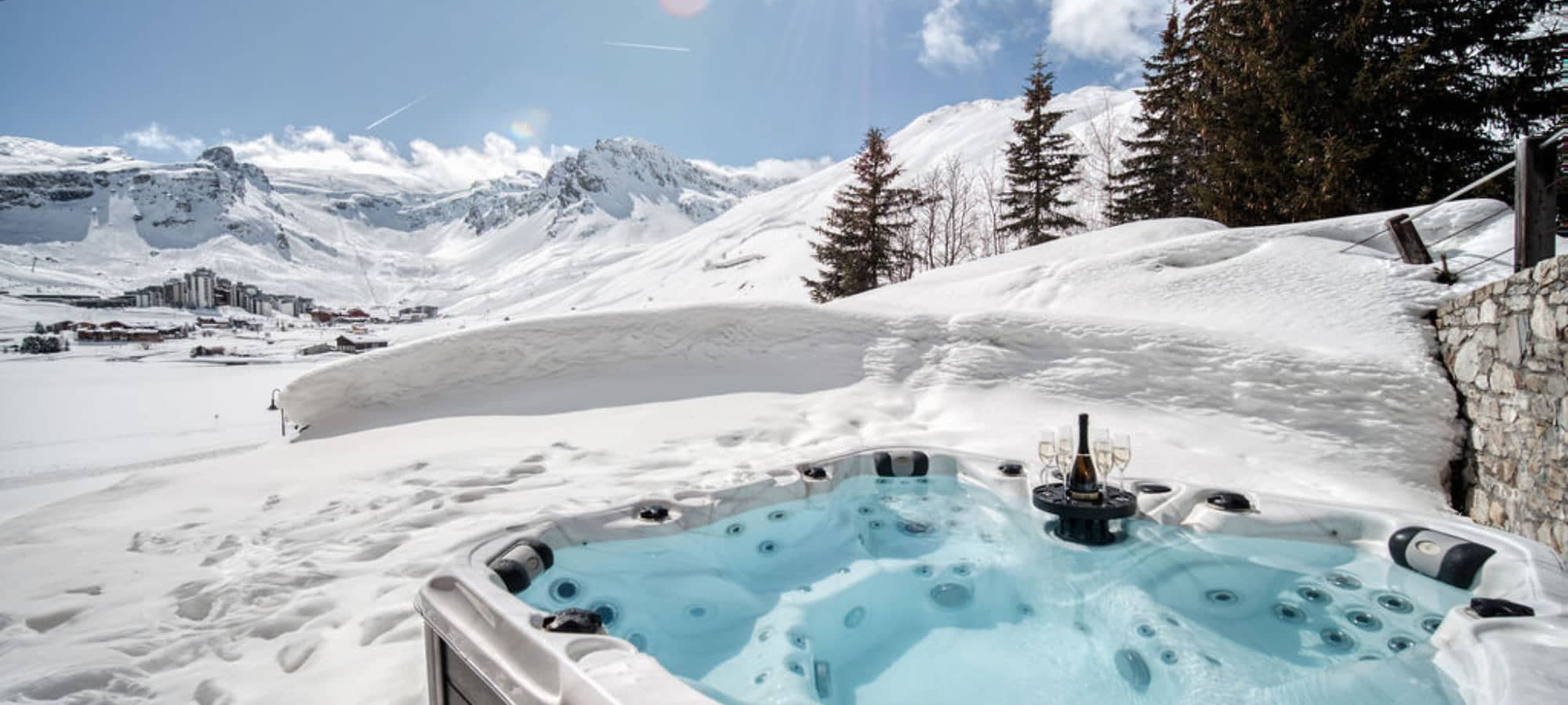 Outdoor hot tub seats 6; snow-surrounded with alpine mountain views