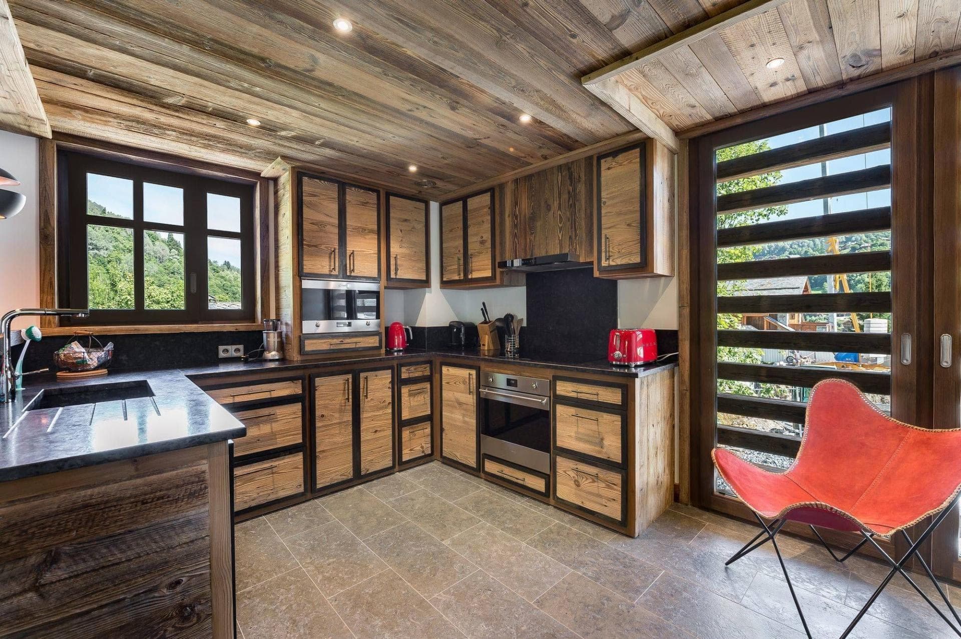 Open kitchen with timber cabinetry beside the dining area