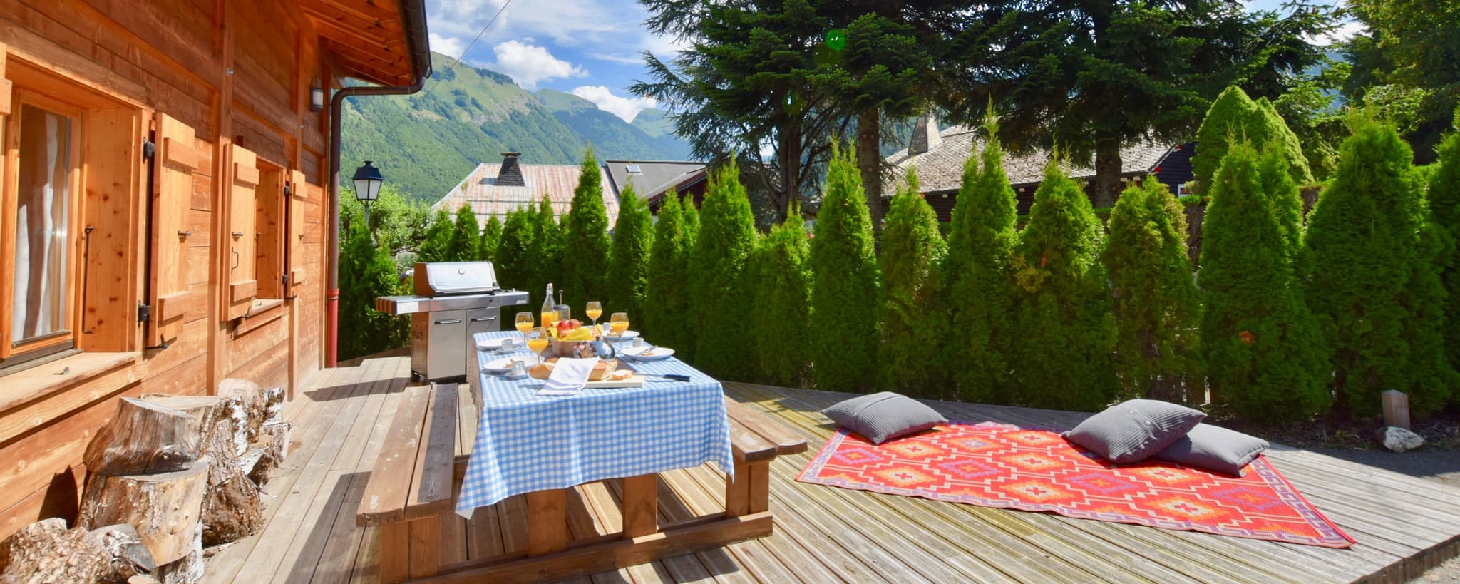 Private deck with gas grill, picnic seating, and mountain views