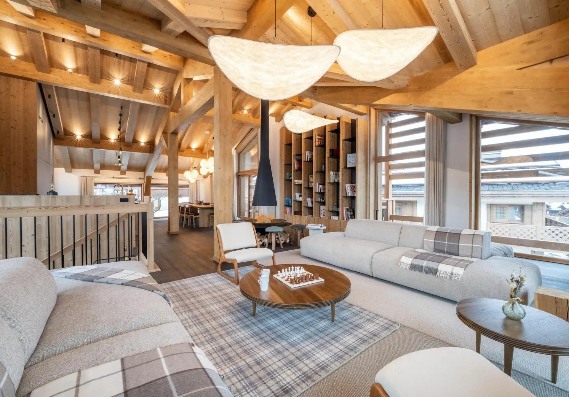 Open-plan living room with fireplace and built-in shelving
