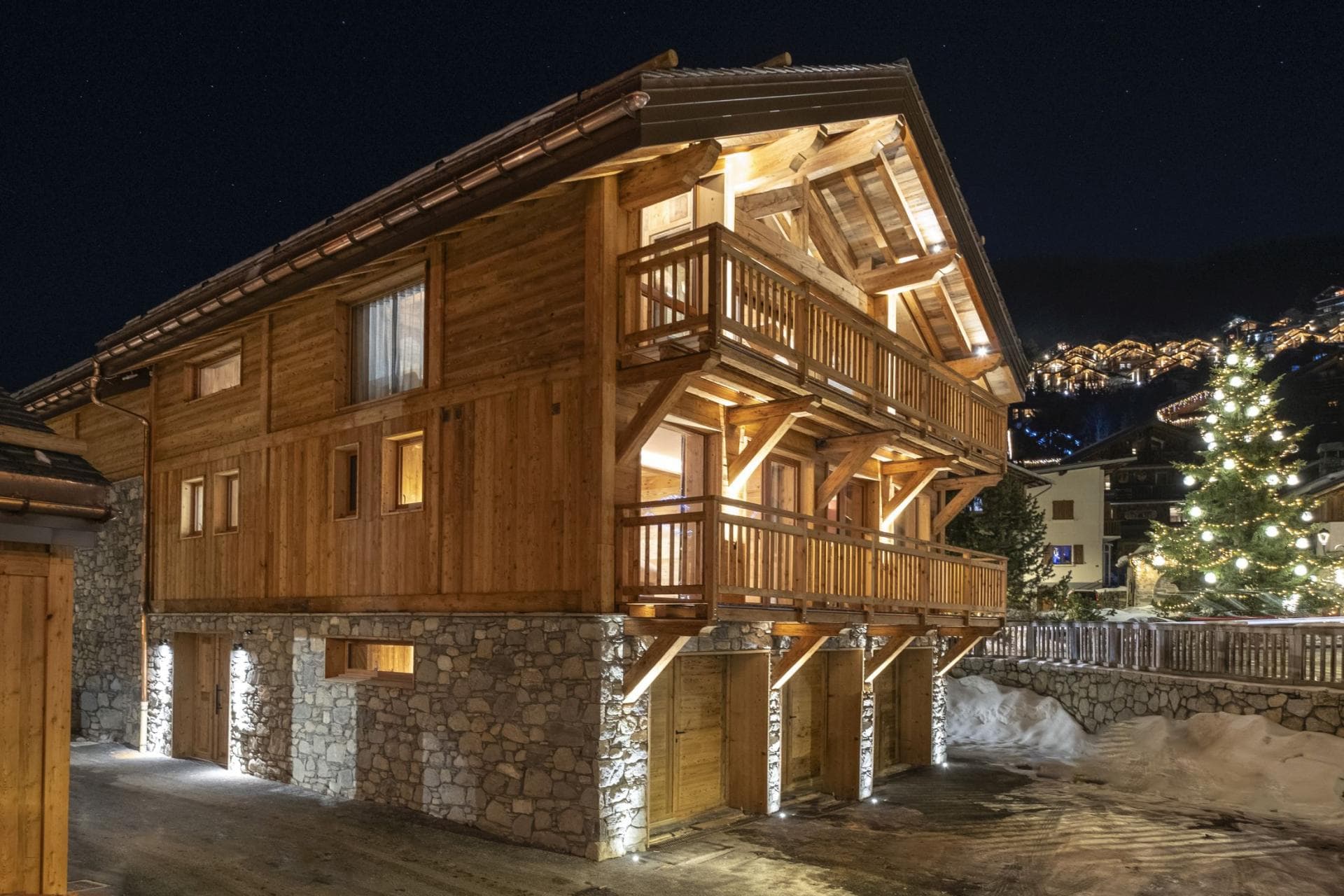 Chalet exterior with two levels of private balconies and covered parking