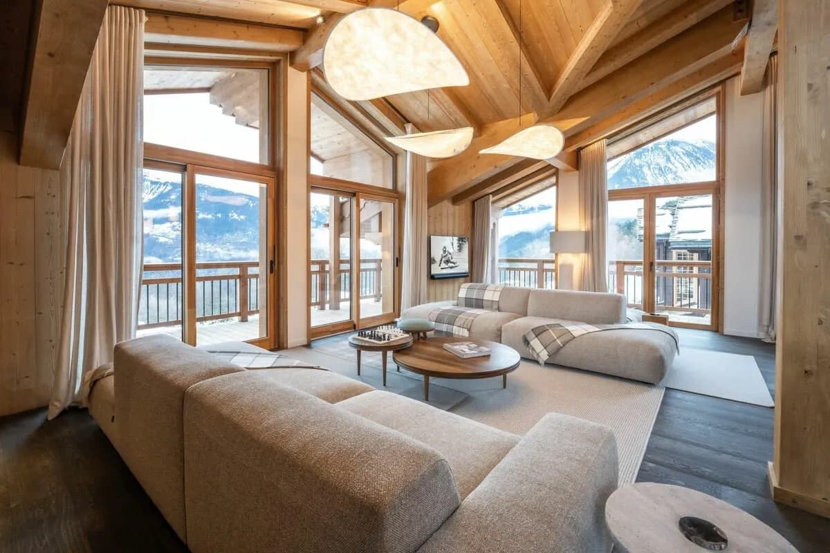 Top-floor living area with floor-to-ceiling windows and wraparound balcony access