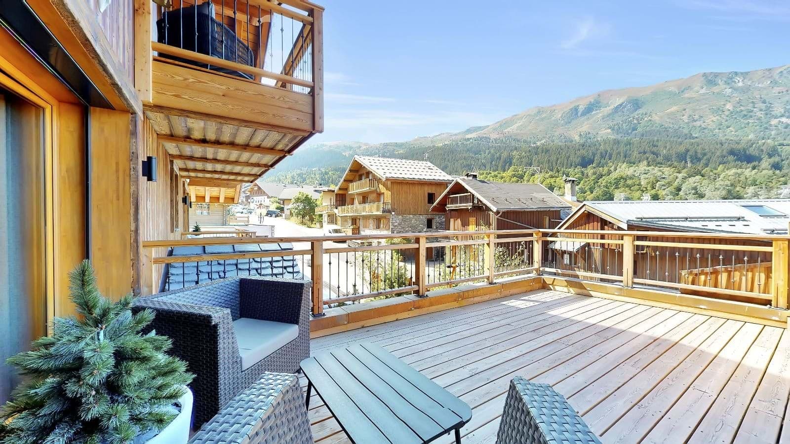 Private wrap-around sun deck with mountain views and lounge seating
