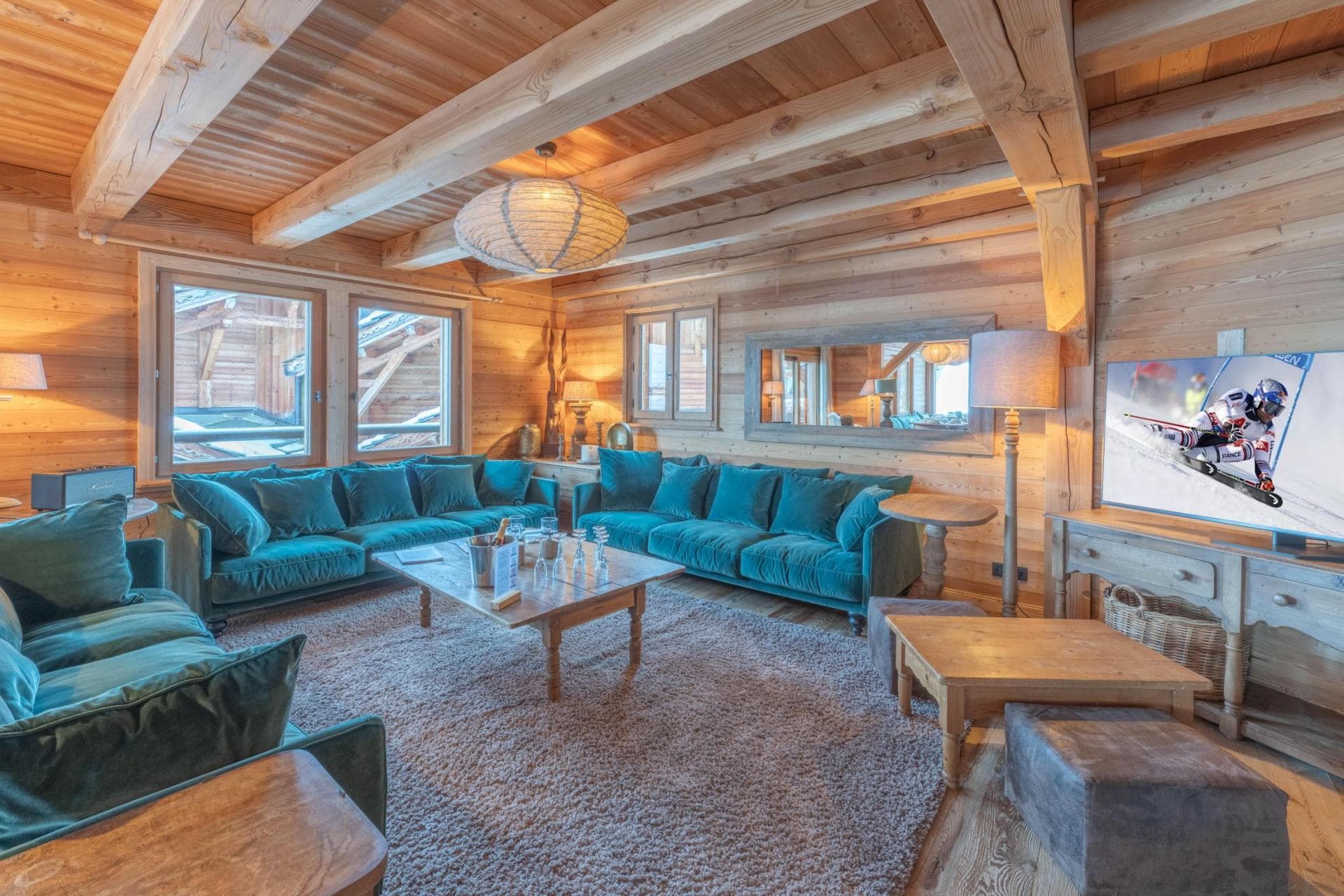 Living room with exposed timber beams and a corner sofa