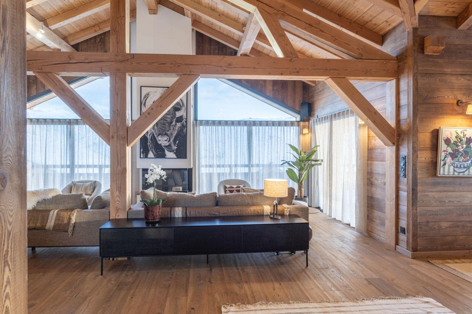 Open-plan living room beneath a vaulted timber ceiling