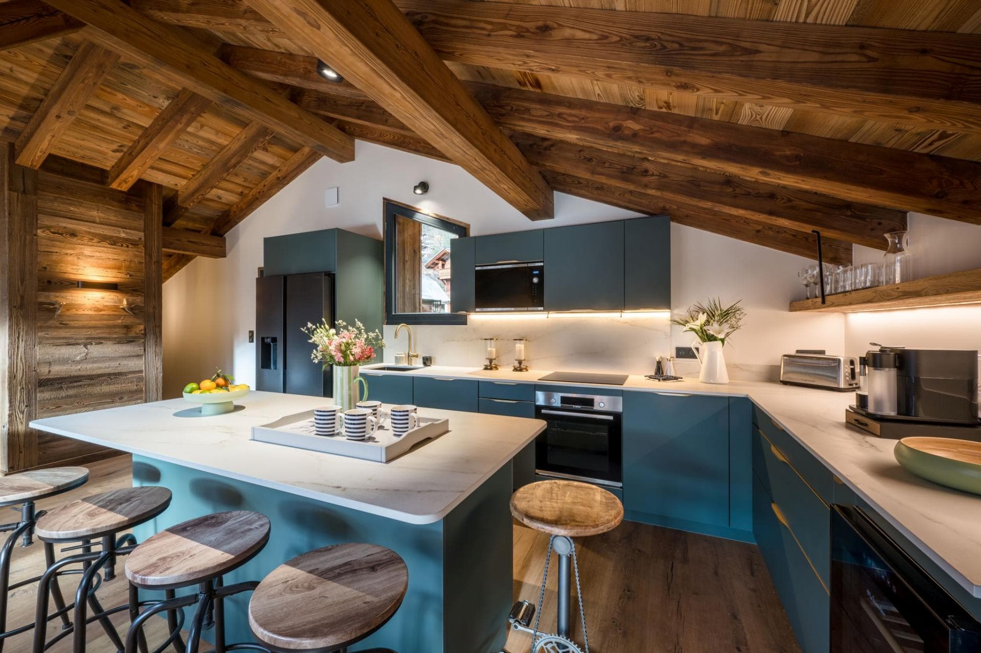 Kitchen with island seating and a vaulted timber ceiling
