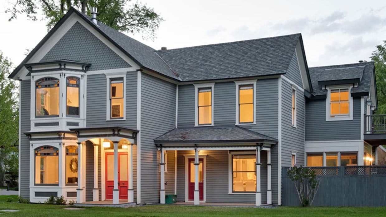 Victorian home exterior featuring original stained glass and covered porch