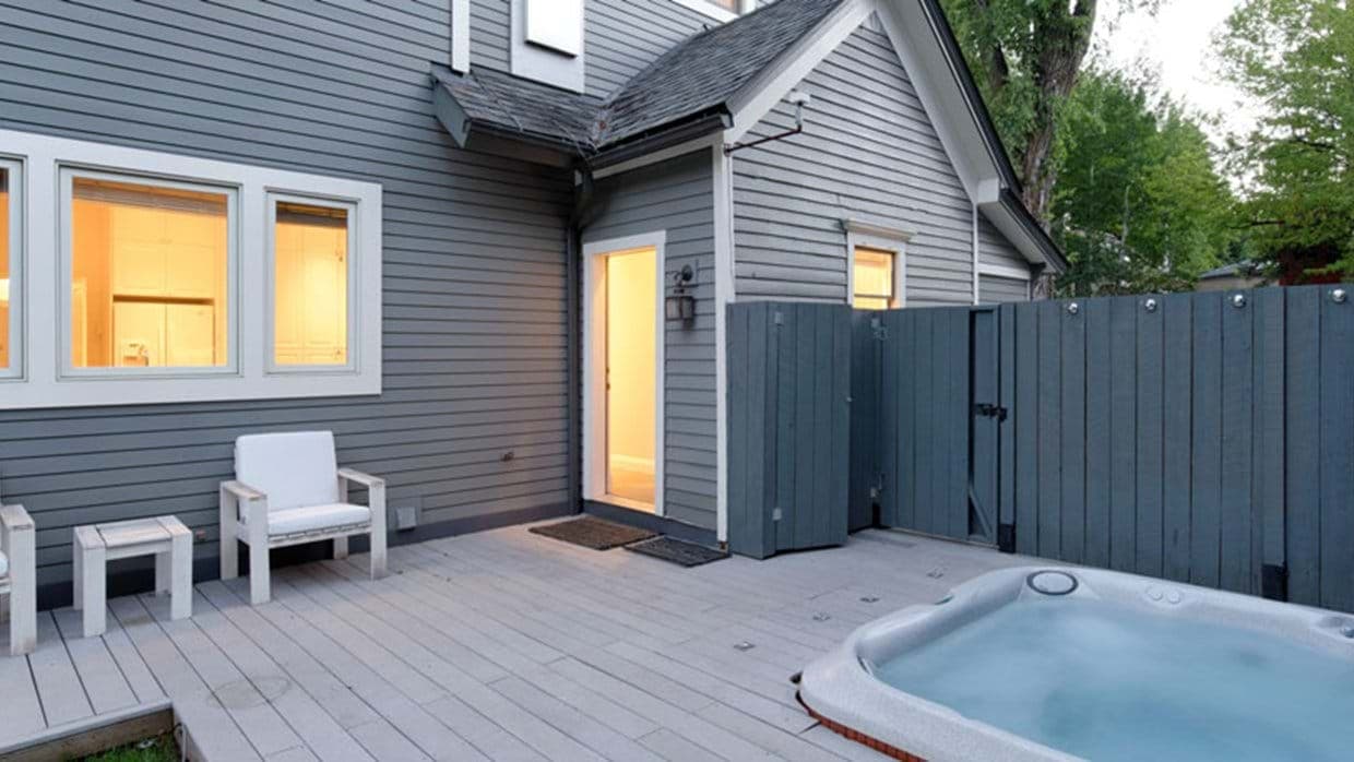 Private deck with recessed hot tub and privacy fencing