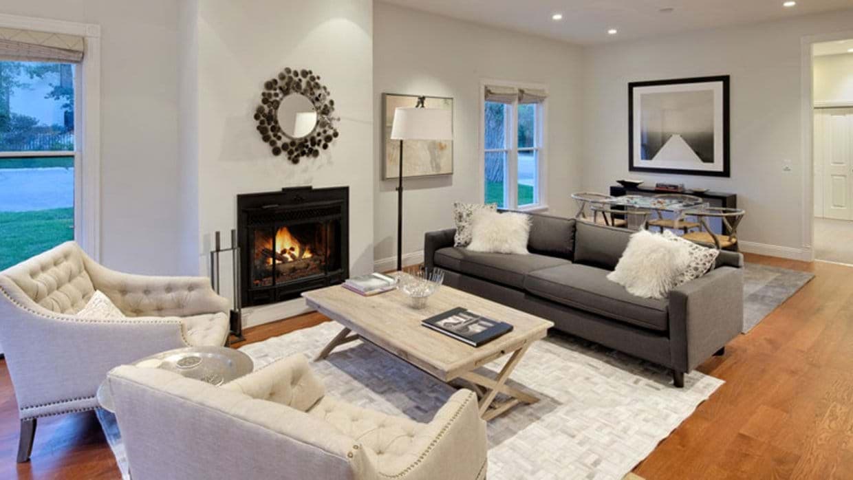 Living area with wood-burning fireplace and seating for six