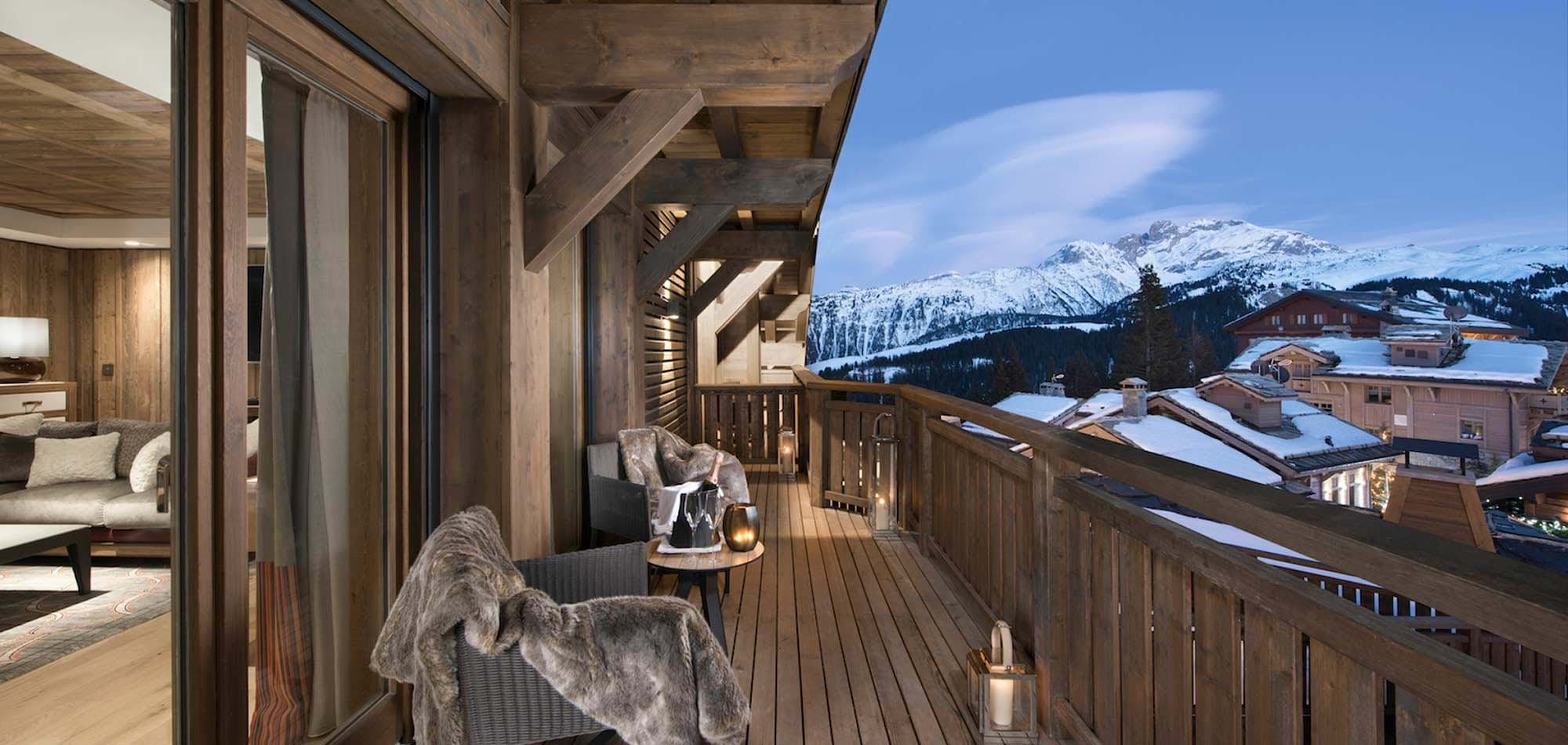 Private balcony with mountain views and lounge seating for two