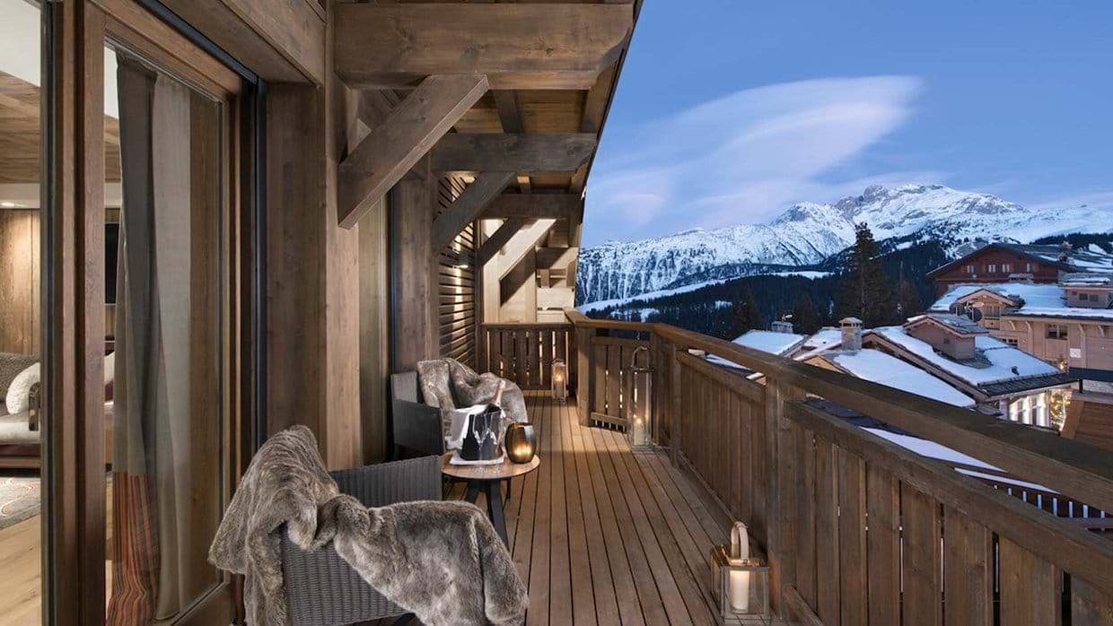 Private balcony with seating and panoramic views of the French Alps