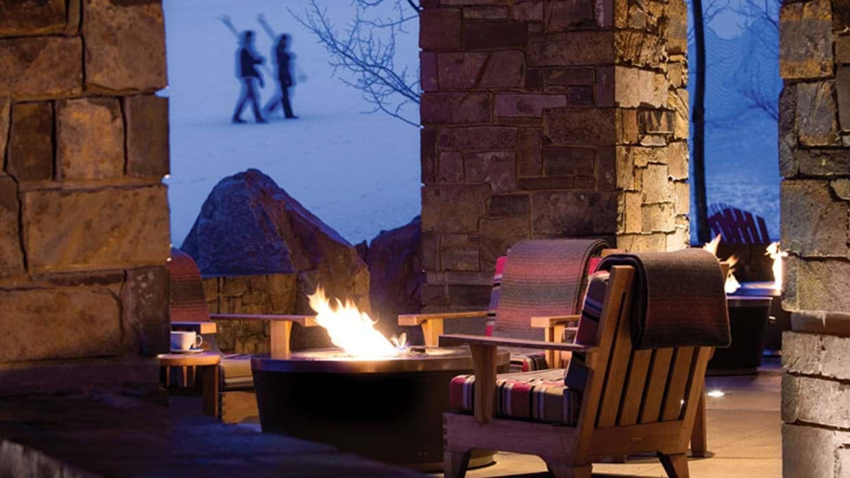 Covered patio with fire pit and ski-in/ski-out access