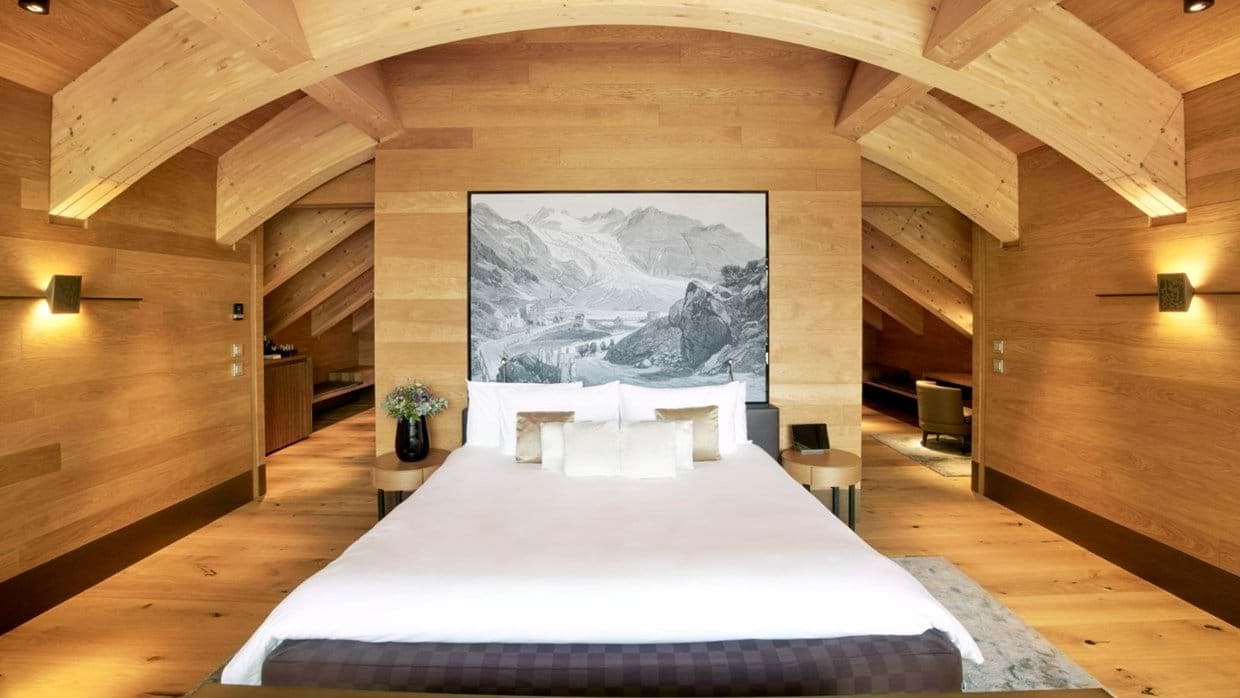 King bedroom with vaulted wood ceilings and integrated bedside lighting