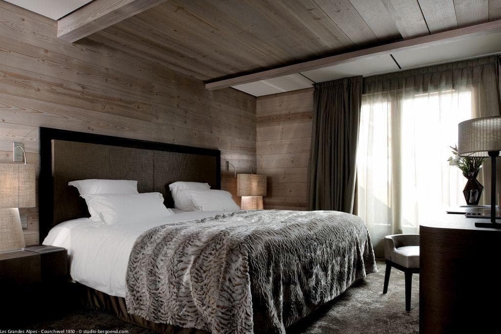 Bedroom with king bed and reclaimed wood walls and ceiling