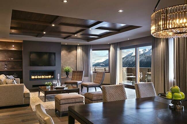 Living area with gas fireplace and mountain-view balcony access