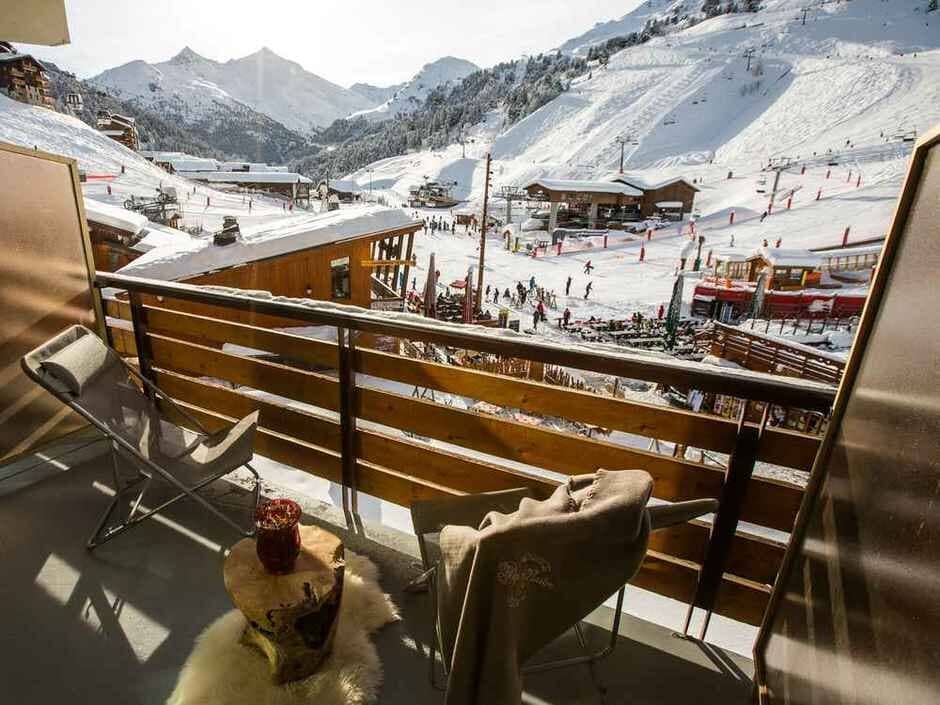 Private balcony overlooking ski slopes and chairlift base