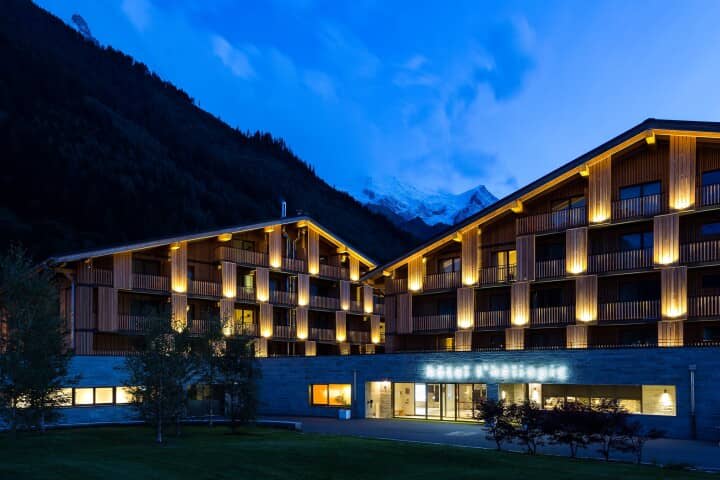 Chalet exterior at dusk with private balconies and Mont Blanc views