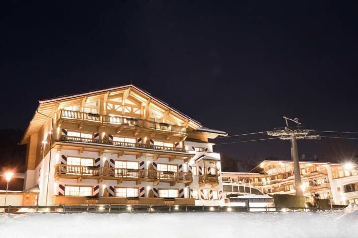 Ski-in/ski-out chalet exterior with private balconies and mountain lift access