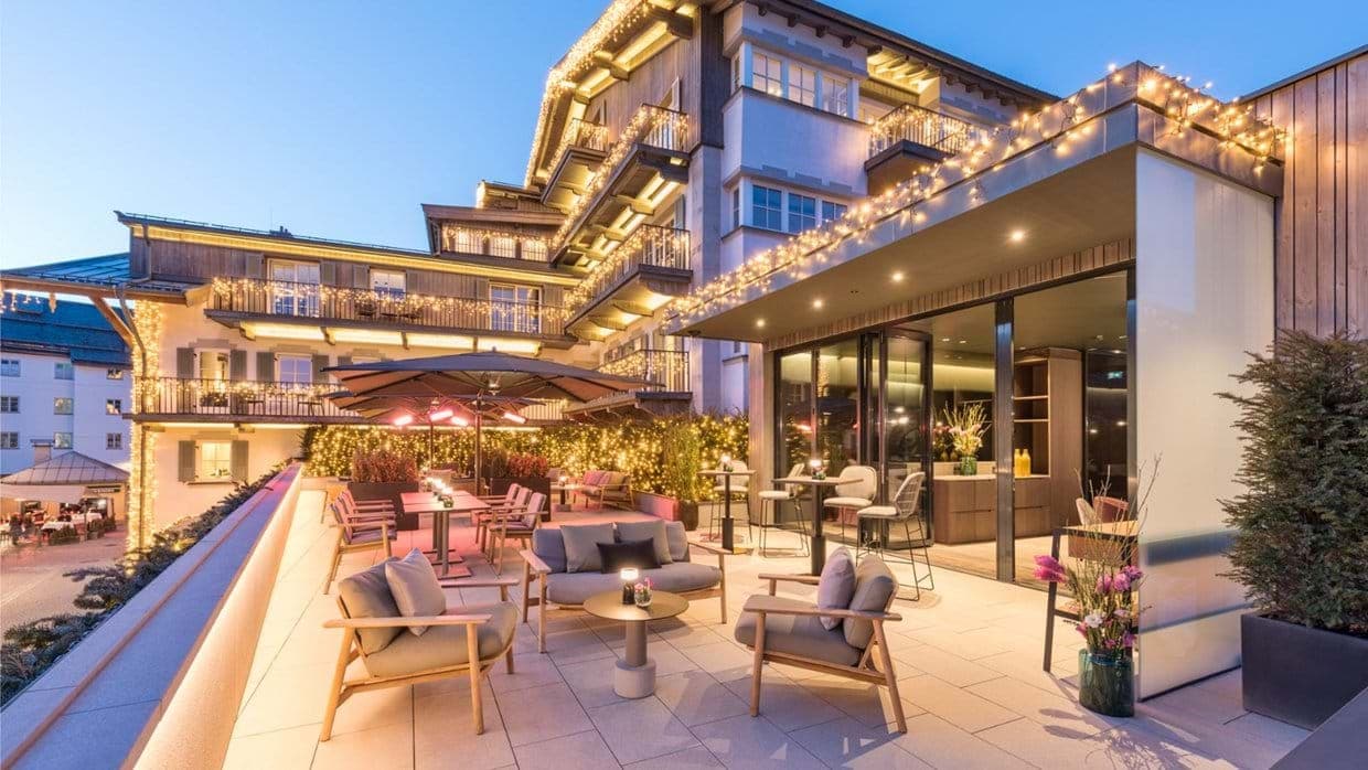 Rooftop terrace with lounge seating and dining area with patio heaters