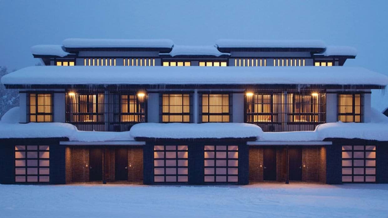 Ski-in lodge exterior with private garage parking and heated driveway