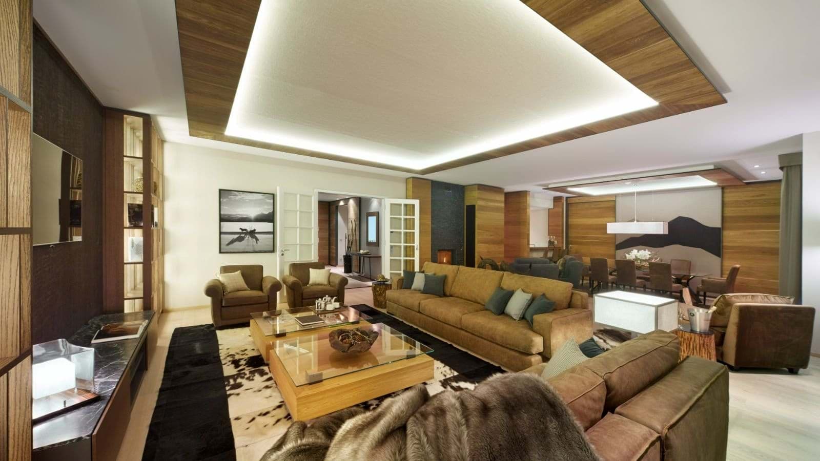 Open-concept living area with fireplace and dining for 8 guests