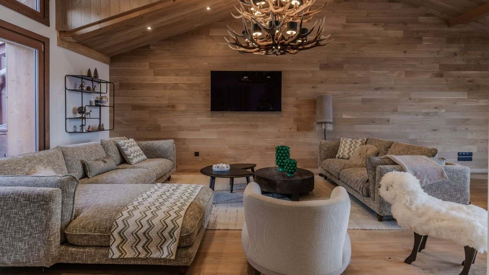 Living area with antler chandelier and seating for 10