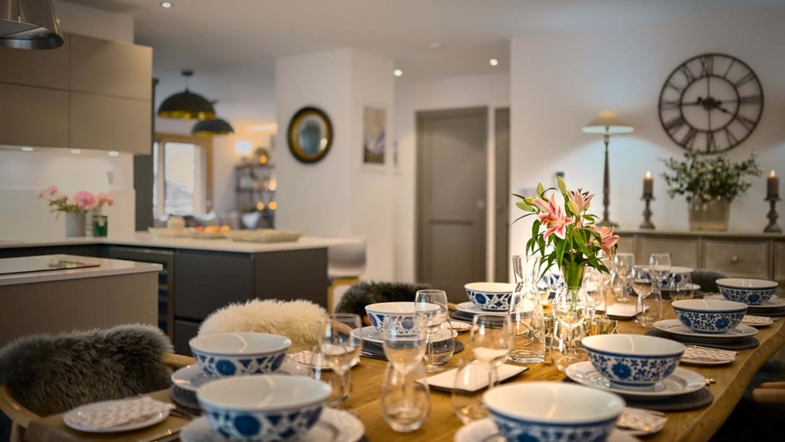 Dining table set beside the open-plan kitchen