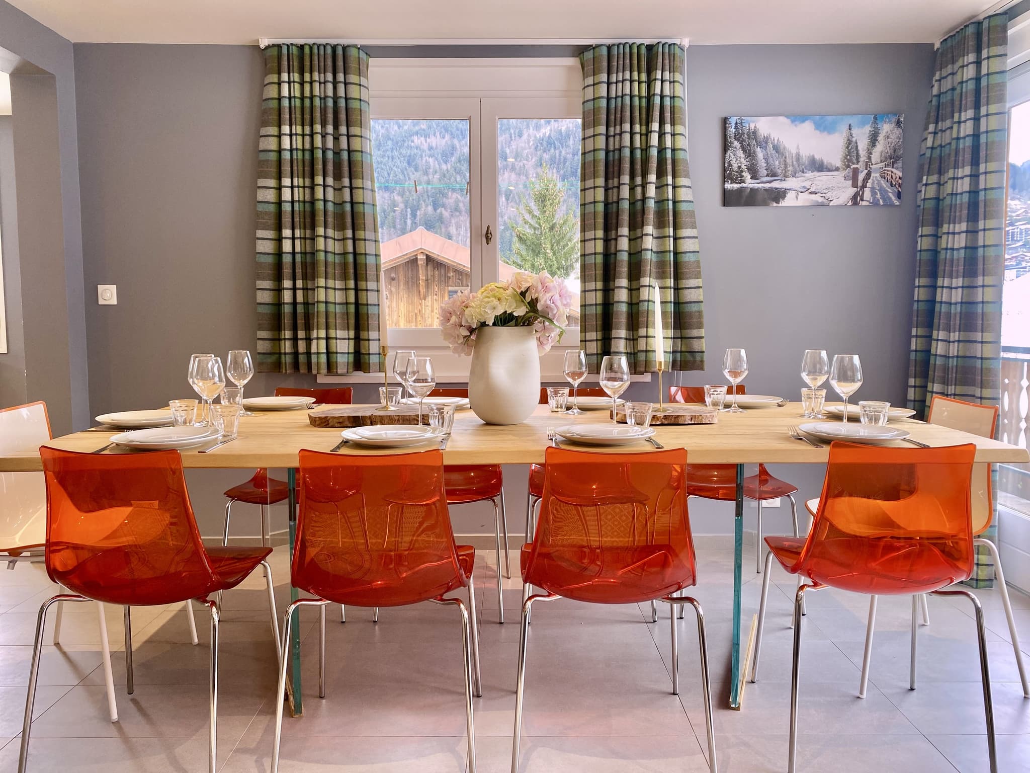 Dining room seats 8; mountain views through glass doors with alpine backdrop