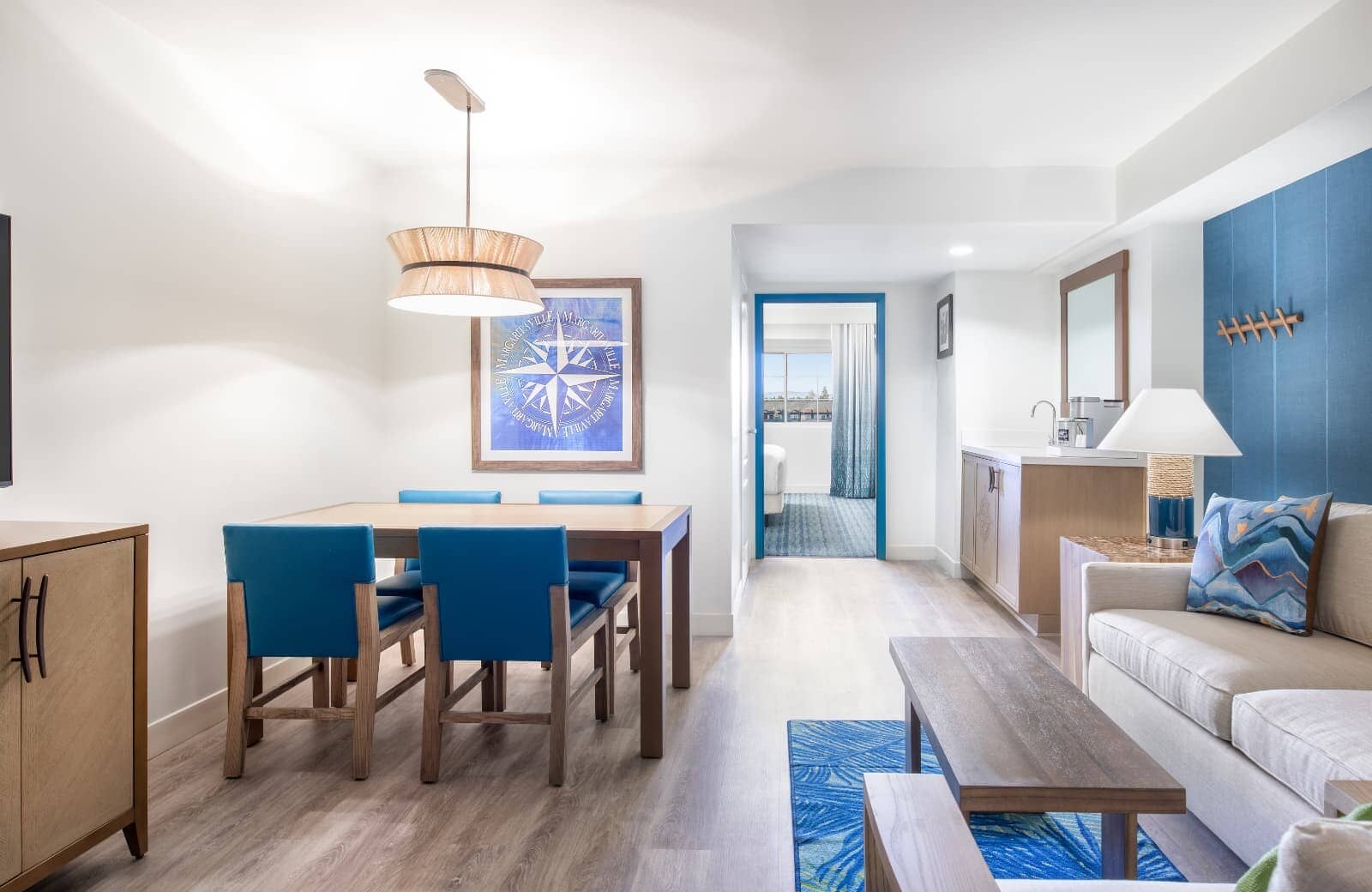 Dining area for 4 with adjacent wet bar and coffee station