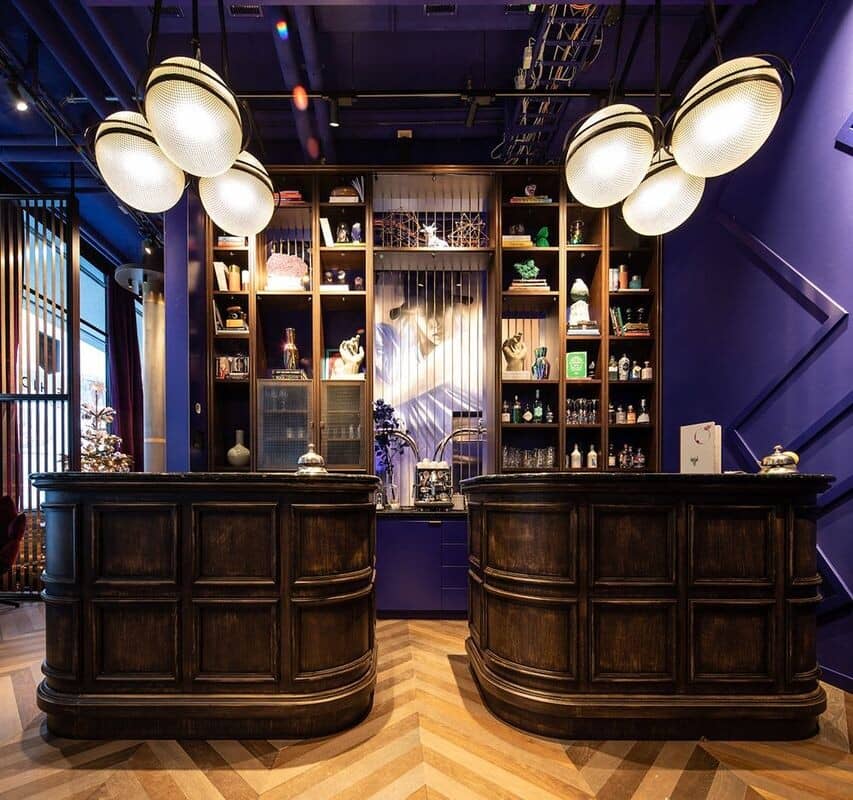 Reception area featuring dual desks and integrated espresso station