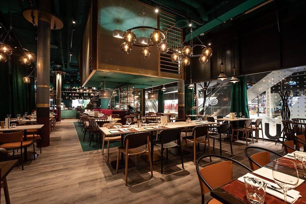 On-site restaurant with industrial lighting and seating for large groups