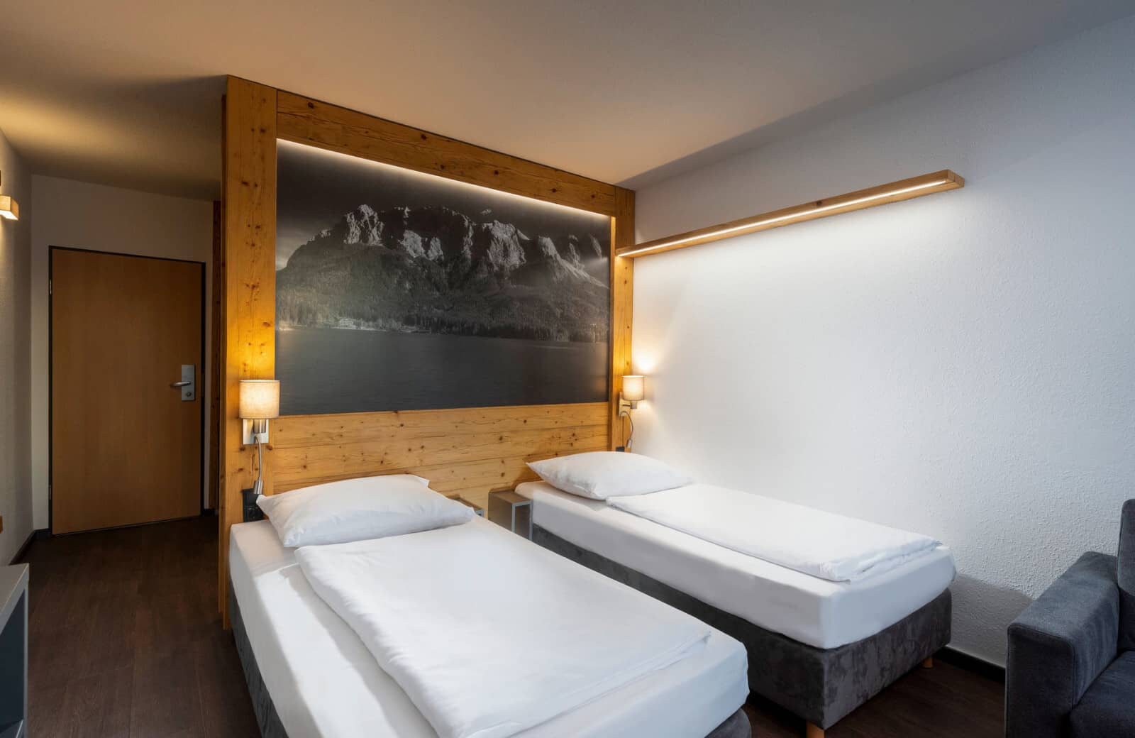 Bedroom with two twin beds and integrated reading lights