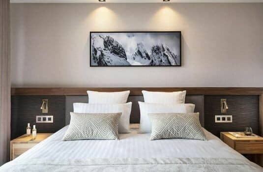 King bed with integrated reading lights and bedside power outlets