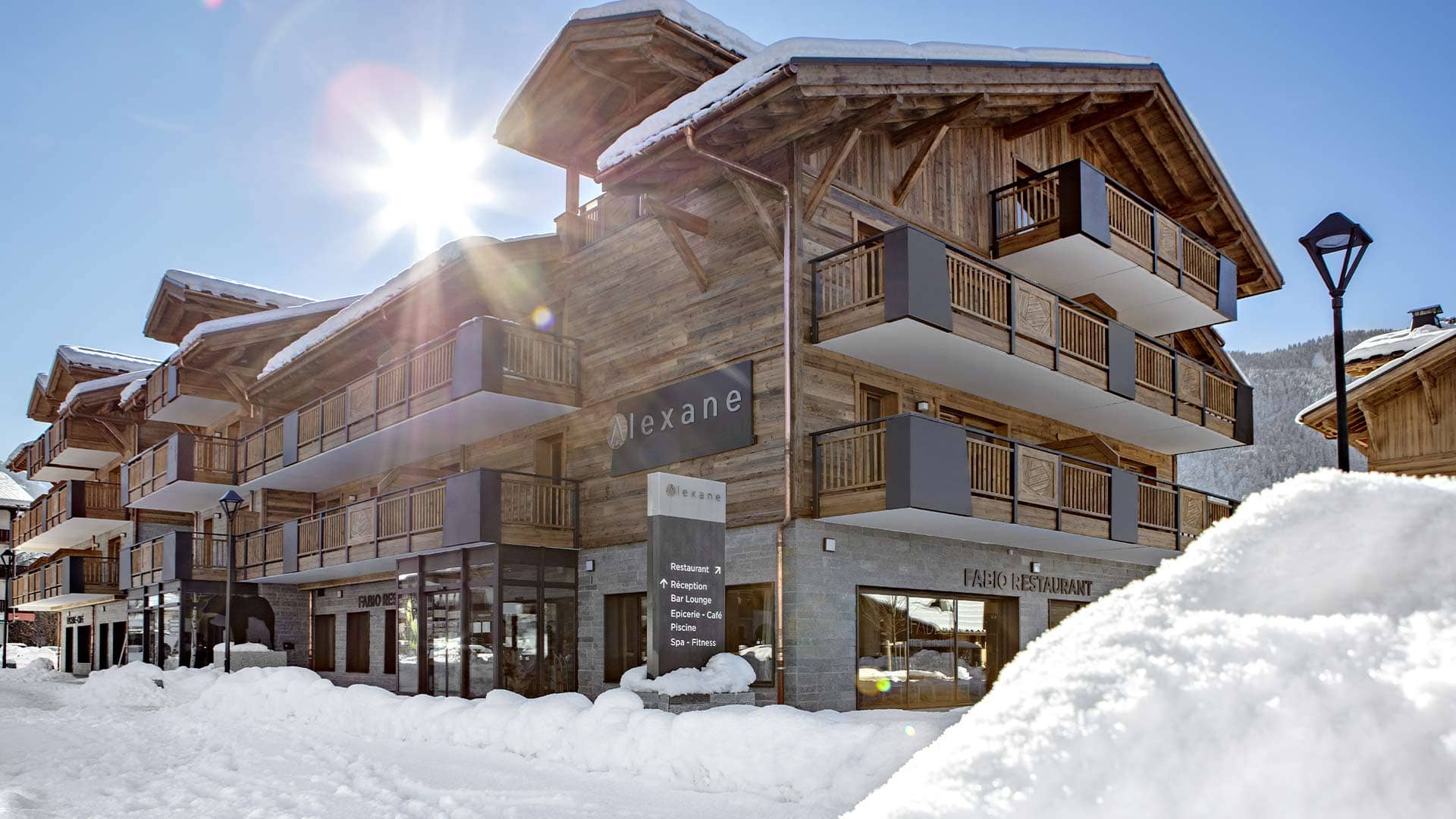 Chalet exterior featuring private balconies and on-site Fabio Restaurant