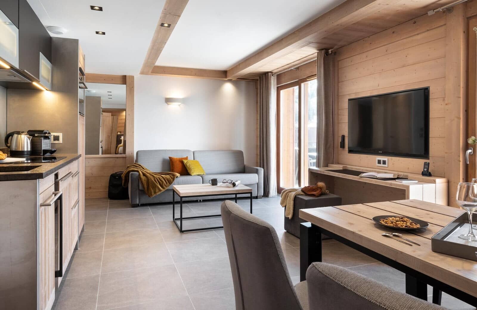 Open-plan living area with sofa bed and Nespresso machine