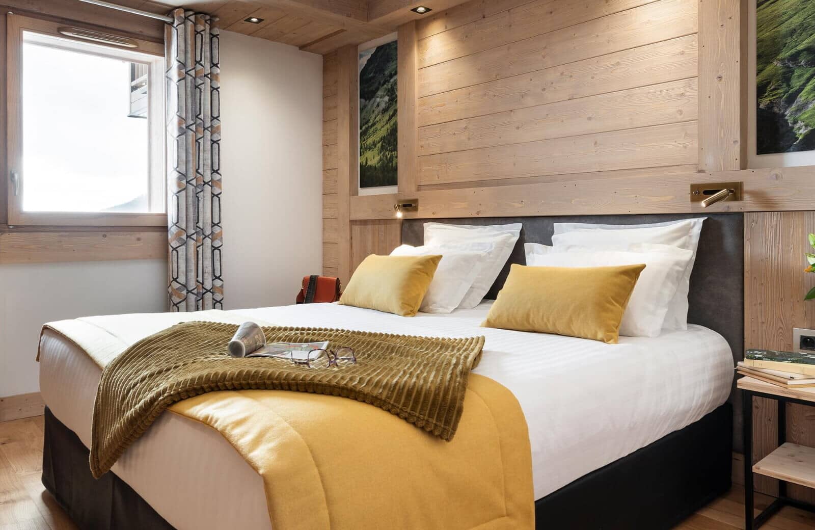 Guest bedroom with king bed and adjustable bedside reading lamps