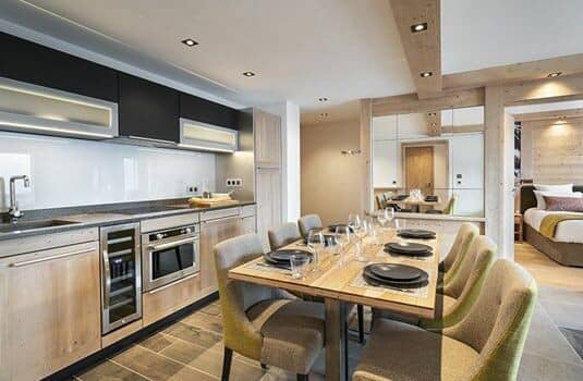 Kitchen and dining area with wine fridge and seating for six
