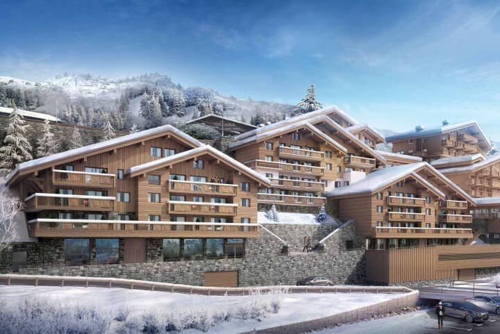 Ski-in/ski-out resort exterior featuring private balconies and underground parking