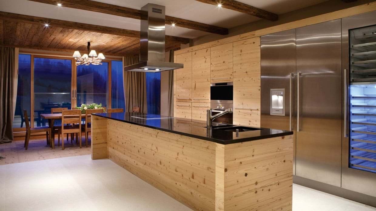 Kitchen island with induction cooktop and dedicated wine refrigerator