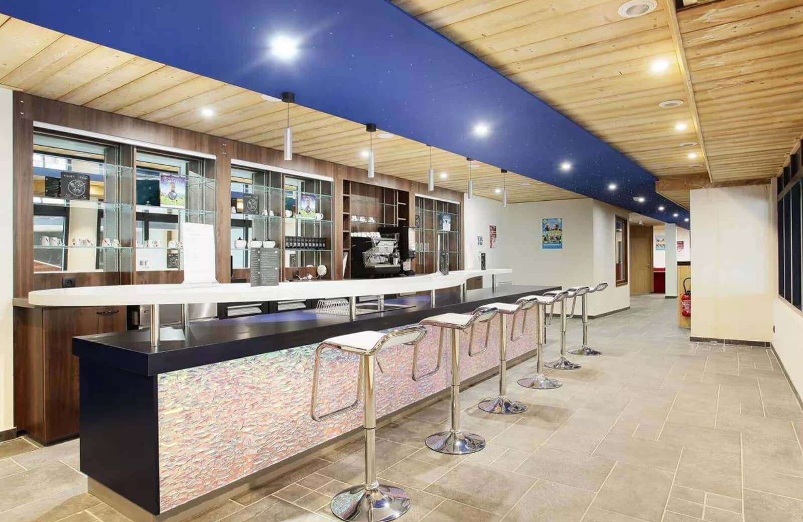 Bar area with espresso machine and seating for 6