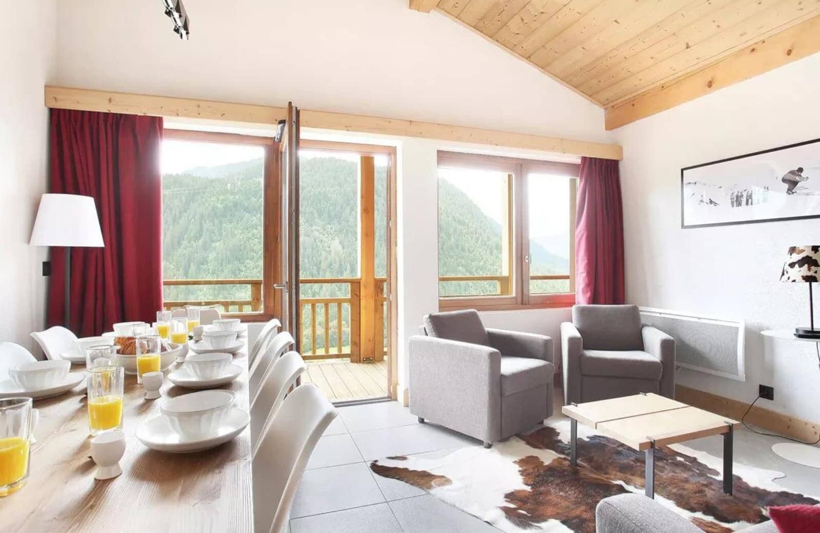 Open-plan living area with vaulted ceiling; dining table seats 8