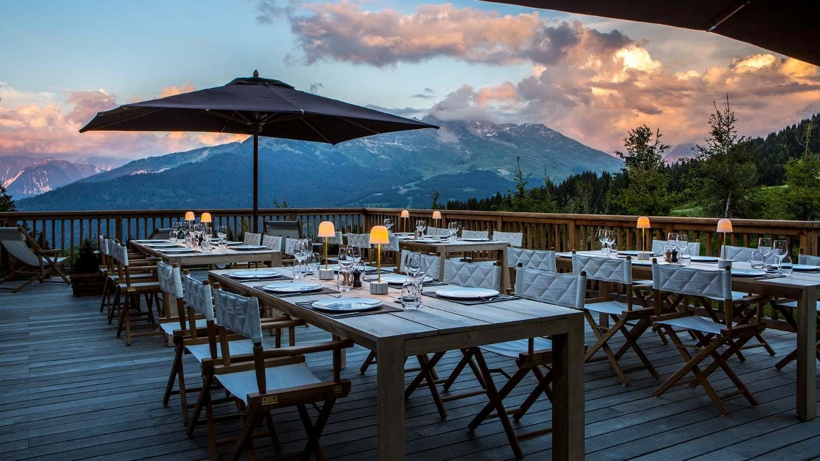 Outdoor dining deck with mountain views and seating for 20+